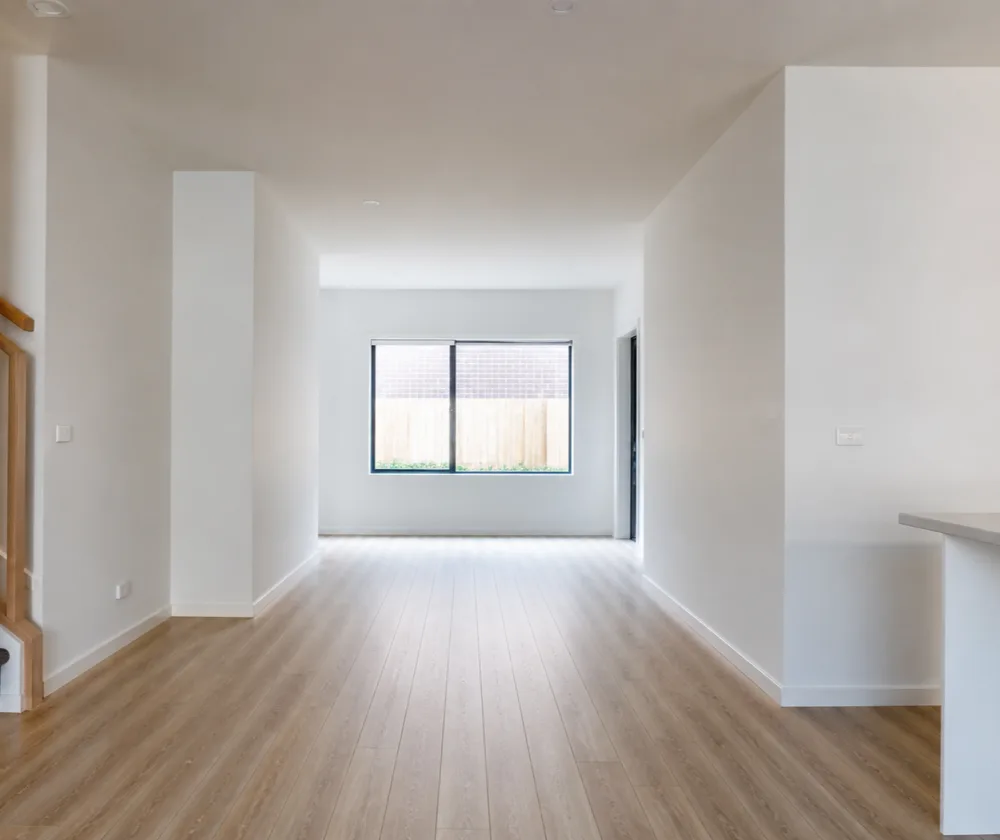 Bond cleaning in Ellenbrook, empty open-plan townhouse living area with clean timber-look flooring