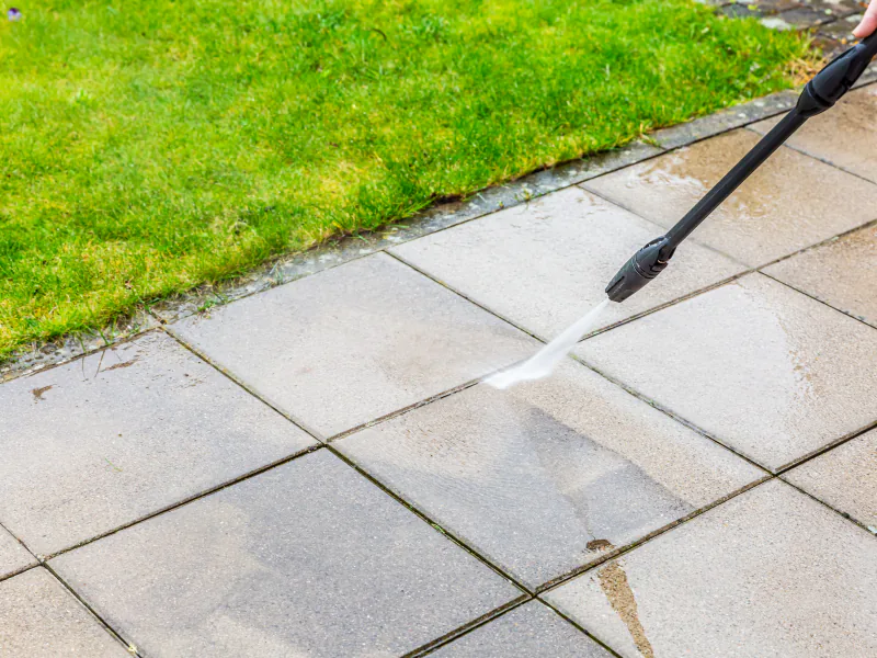 Close up of a terrace being cleaned with a high pressure water jet